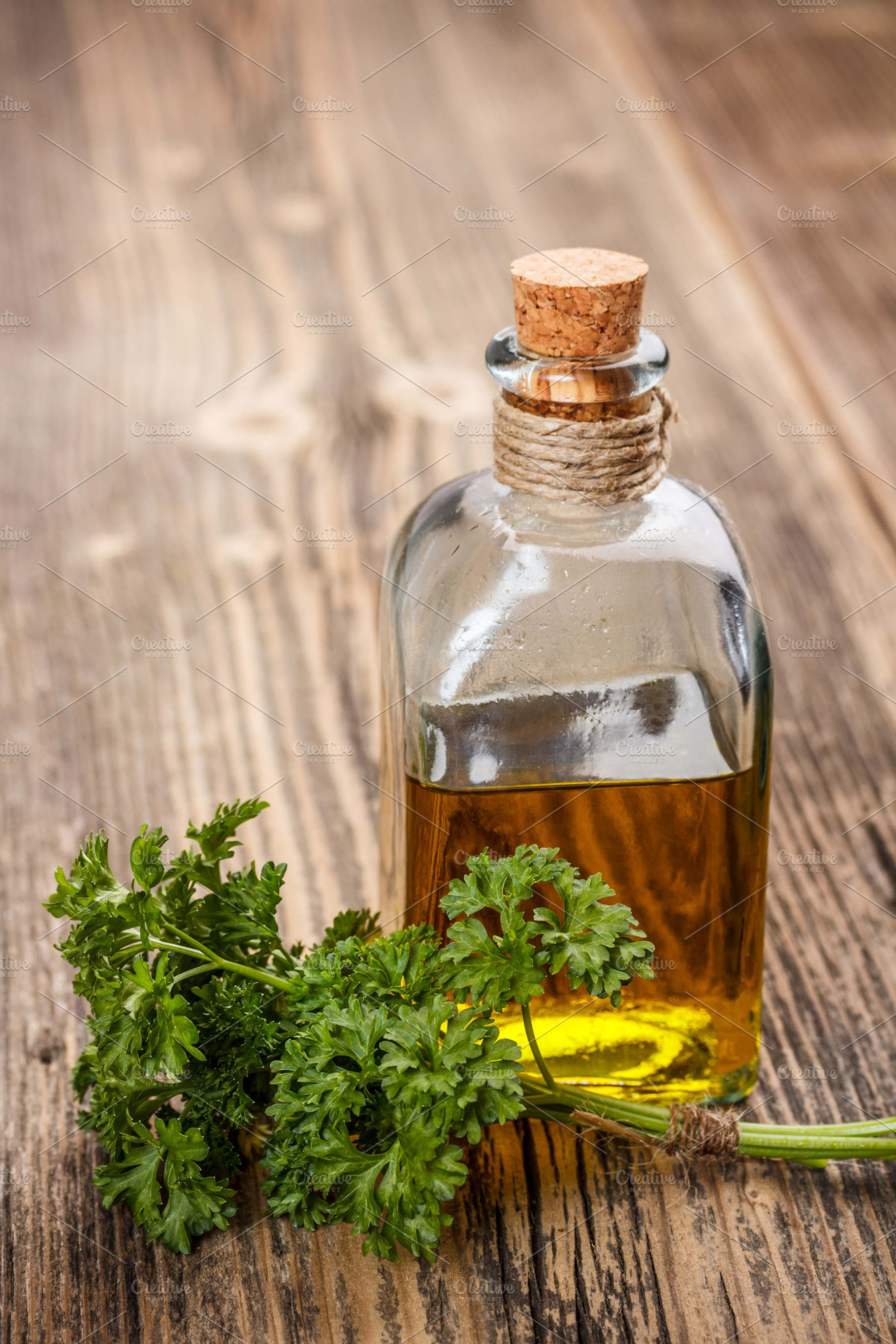 Bottle with oil stock photo containing oil and leaves