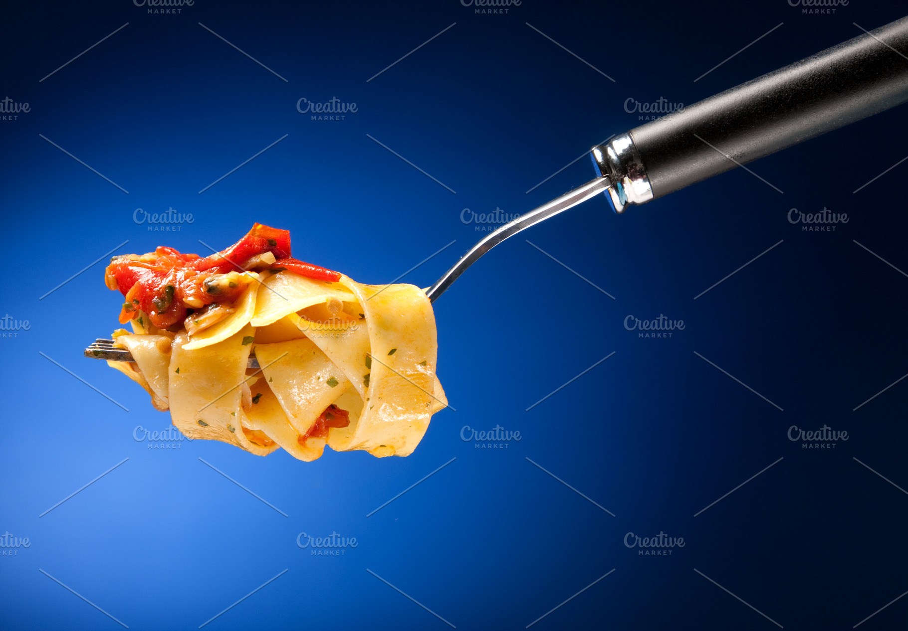 Tagliatelle with clams on a red background, a Food & Drink Photo by FoodStock