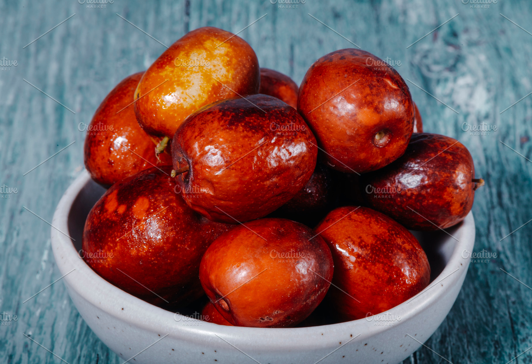 ceramic bowl with some mature jujube fruits, a Photo by Nito