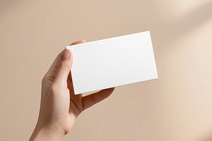 Hand holds blank business card, a Business Photo by MistyDay