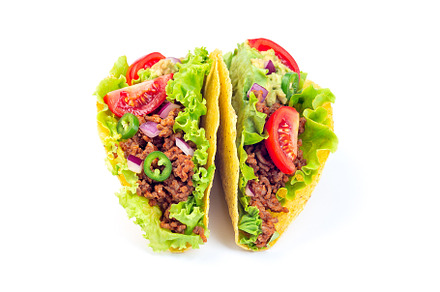 Two taco shells isolated on white, w, a Food & Drink Photo by iuliia_n