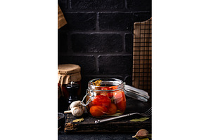 Marinated pickled tomatoes in jar, a Food & Drink Photo by Yulia Furman