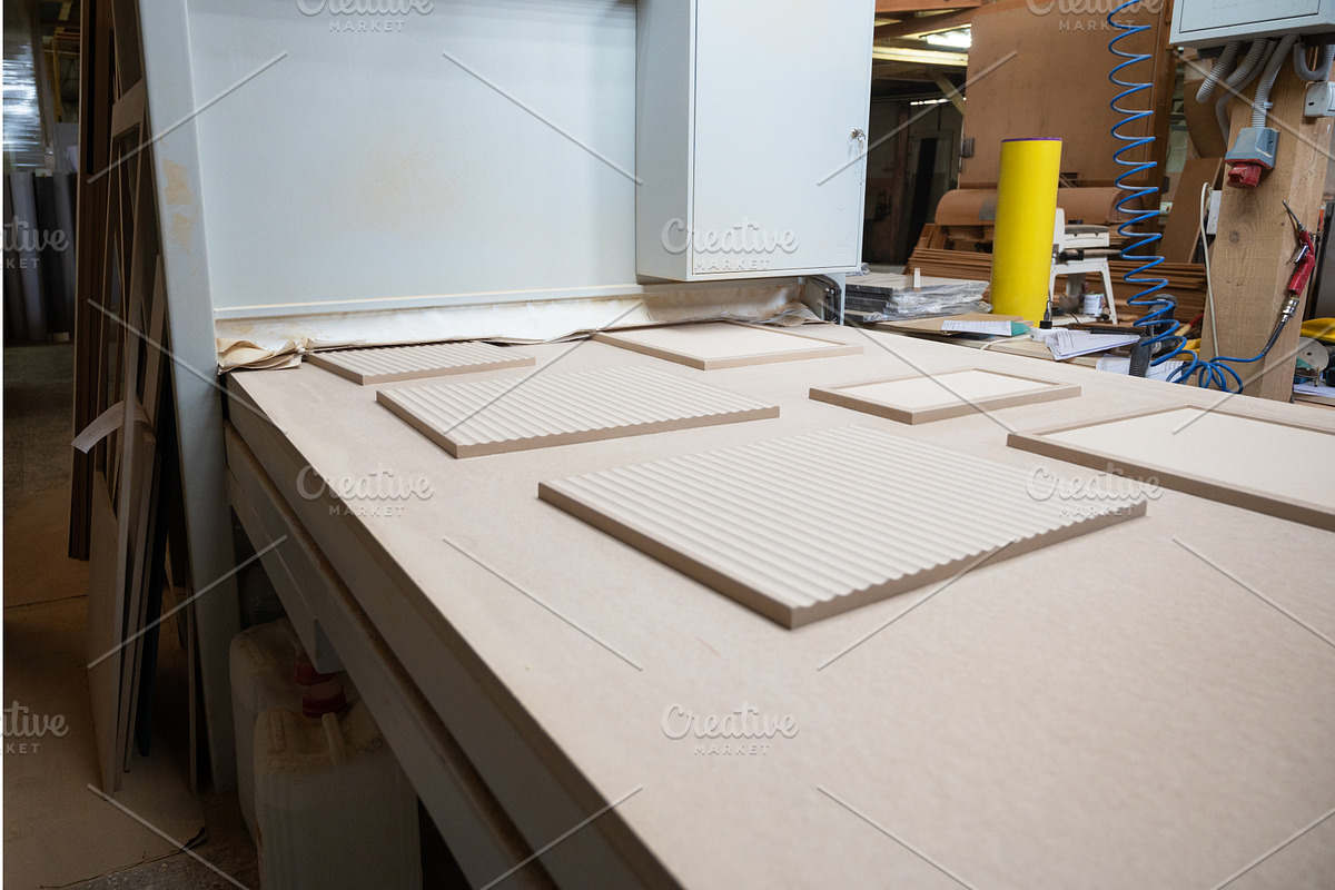 Grinding of wooden furniture panels, a Graphic by Jan Jack Russo Media