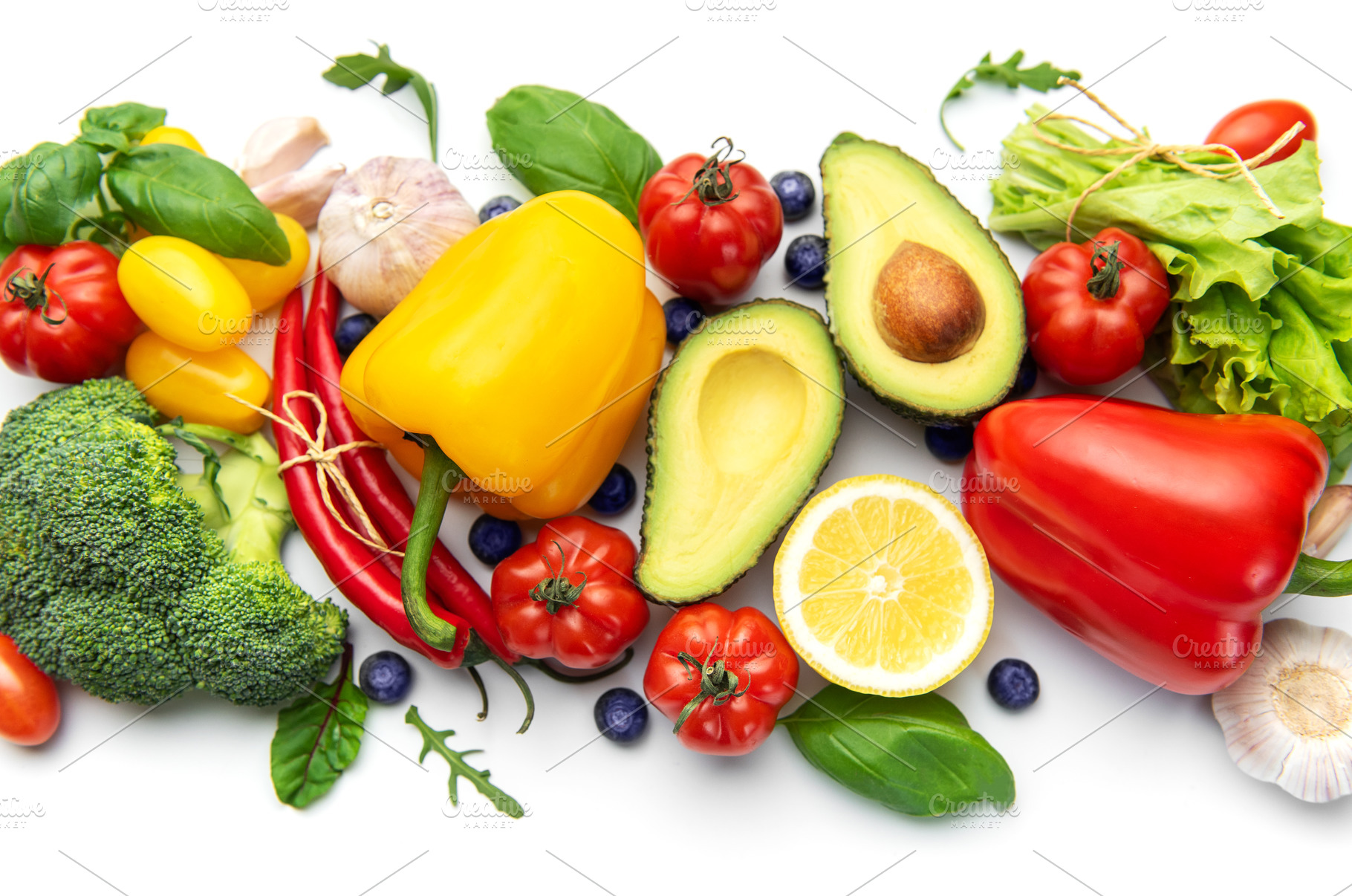 Assortment of fresh organic vegetables and fruits on white, a Food & Drink Photo by Olena Rudo