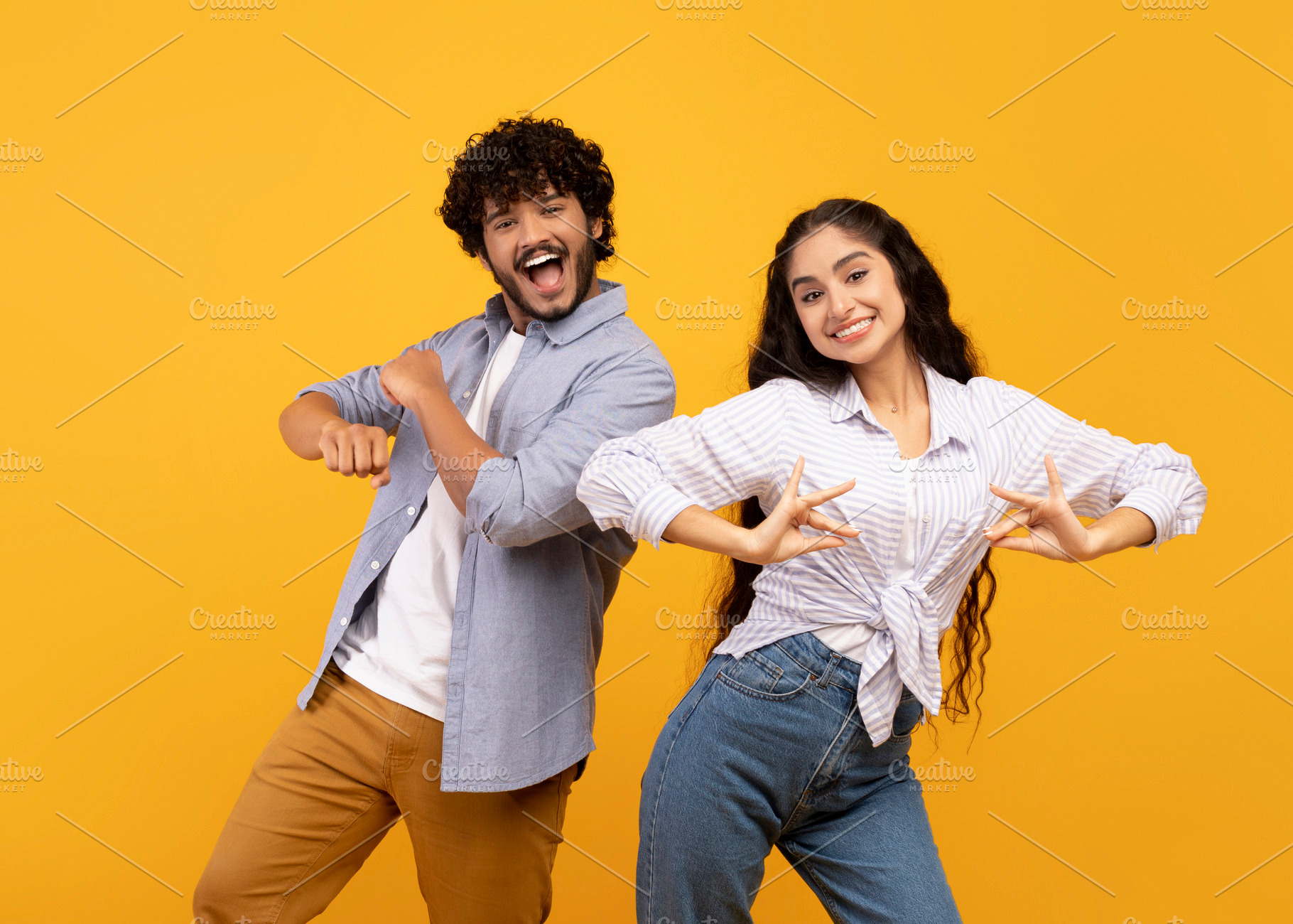 Having fun. Joyful young indian couple dancing and fooling around, enjoying fav, a Person Photo by Prostock-Studio