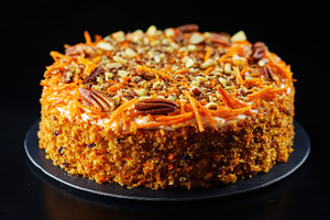 Deliciously moist carrot cake topped, a Photo by Pavel_design