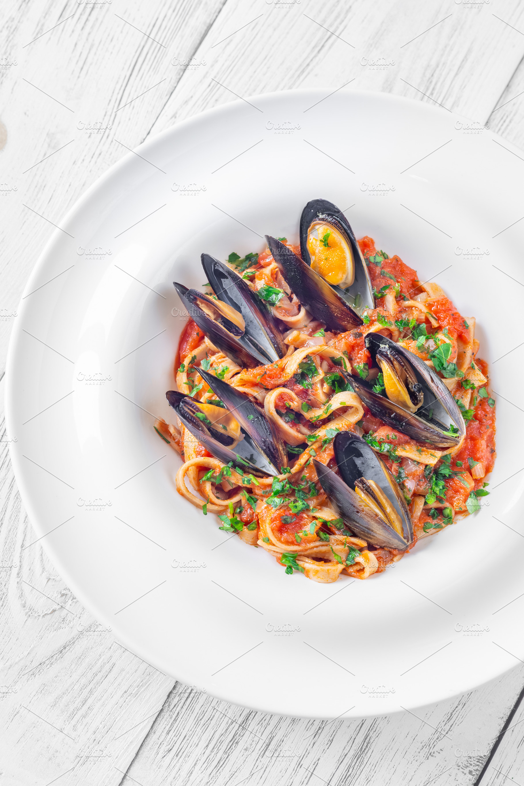 Marinara Mussel Pasta, a Food & Drink Photo by Alexander Prokopenko