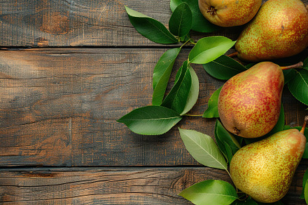 Red pears with leafs and copyspace for text on wooden table, a Food & Drink Photo by AlyaAnd
