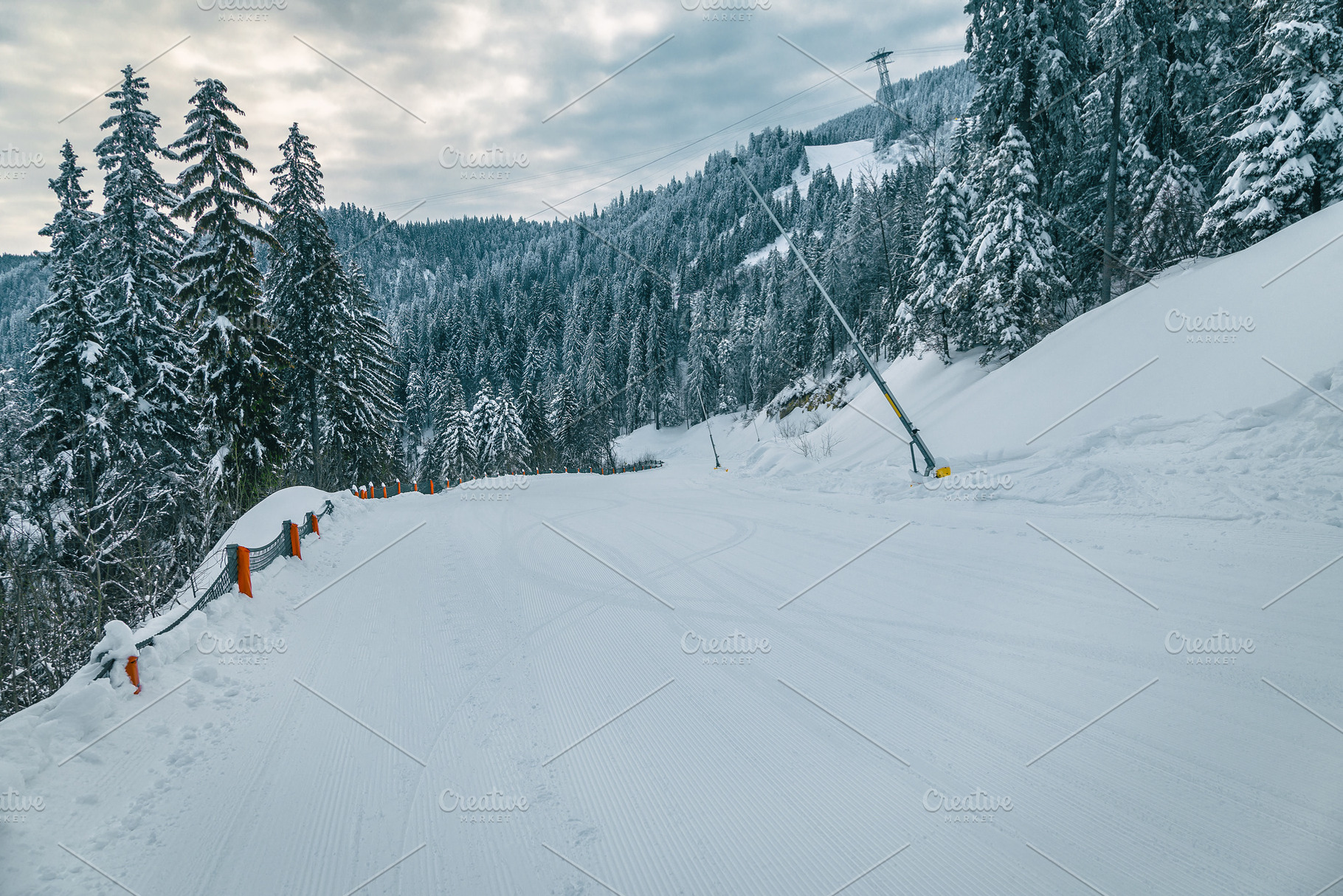 Prepared ski slope with snow cannons, a Nature Photo by Alpine Dreams