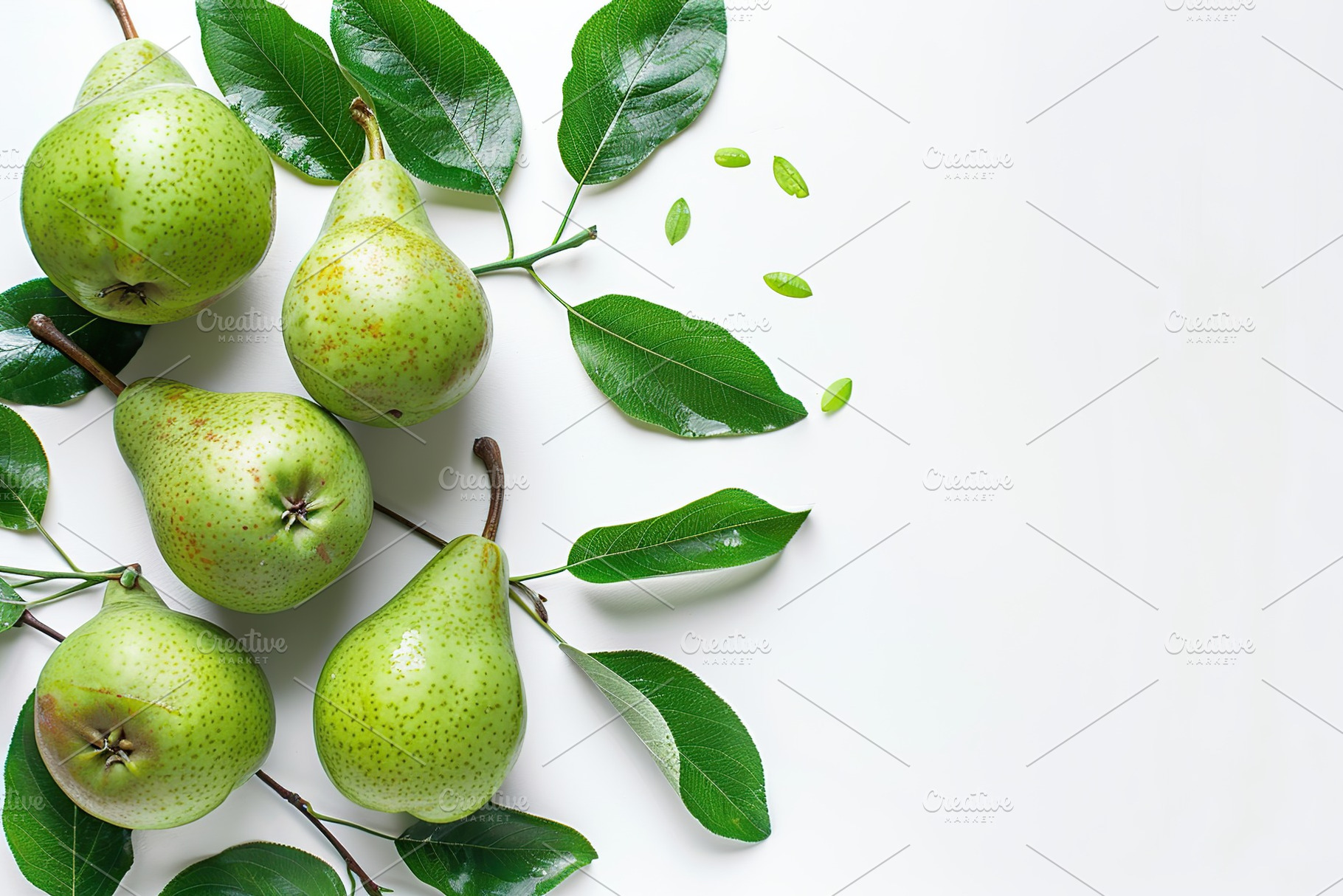 Green pears with leafs and copyspace for text on white background, a Food & Drink Photo by AlyaAnd