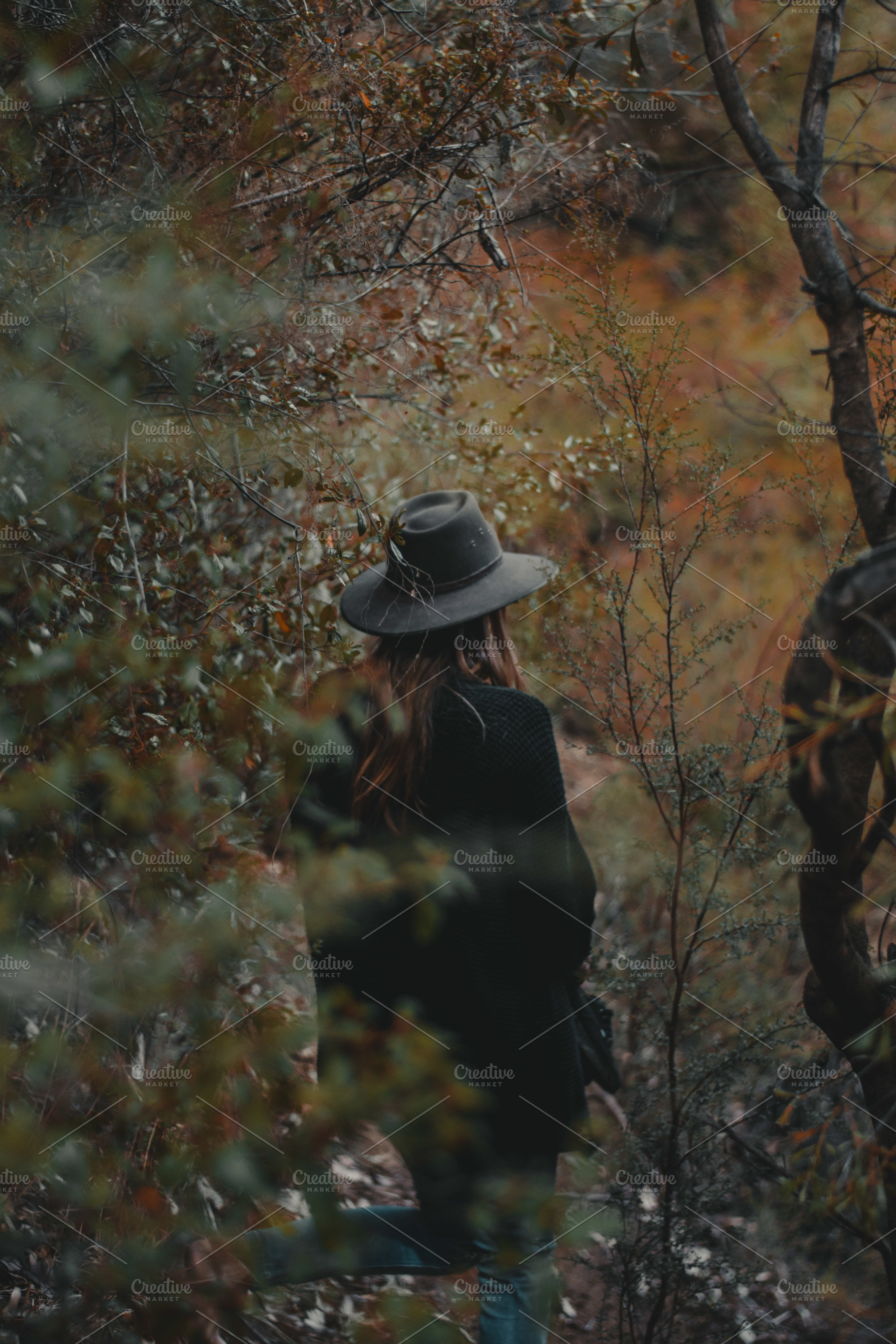 Girl in trees containing green, bush, and bushes, a Nature Photo by Fossilized Tree Sap