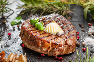 Grilled delicious ribeye steak, a Food & Drink Photo by Volff