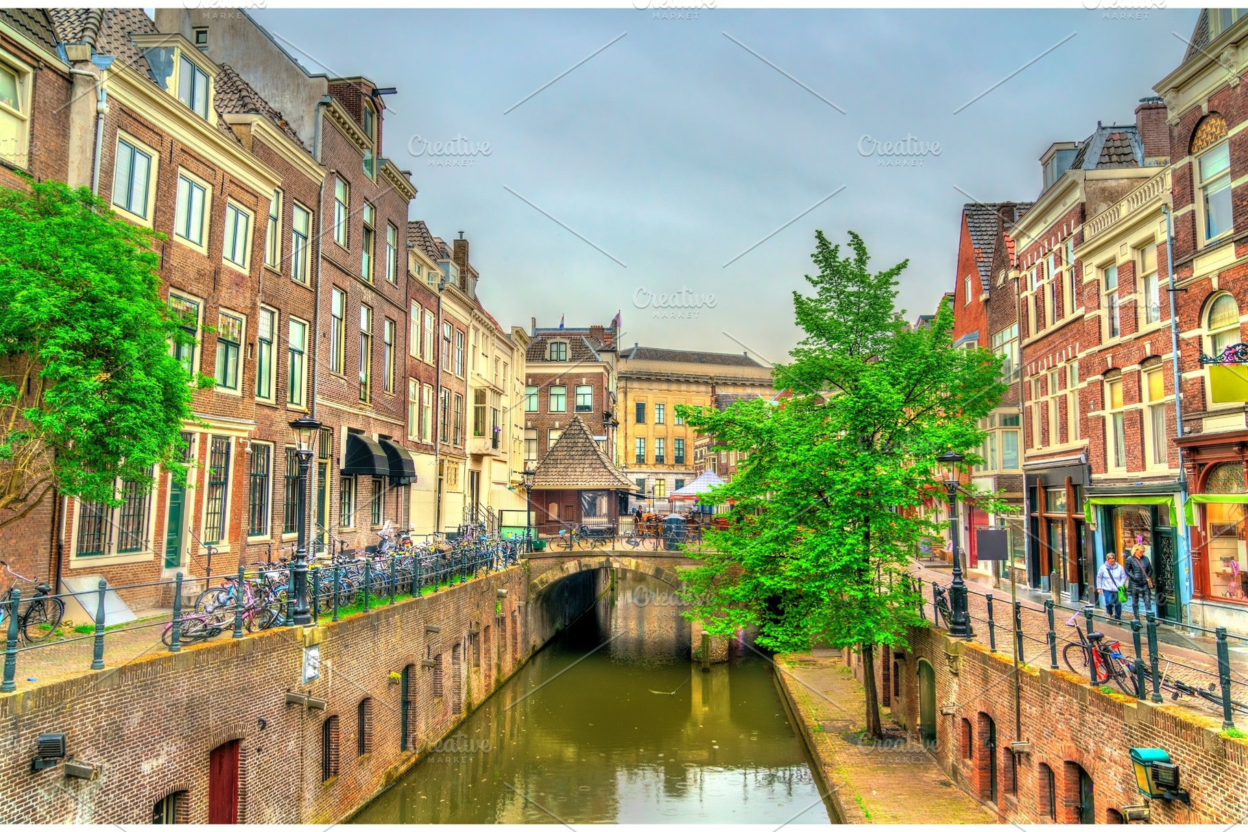 Traditional houses along a canal in utrecht netherlands featuring utrecht, an Architecture Photo by Leonid Andronov