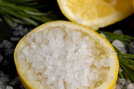 slices of sour lemon on a black board, a Photo by MyPhotos