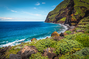 Amazing seaside steep green slope, a Nature Photo by Alpine Dreams