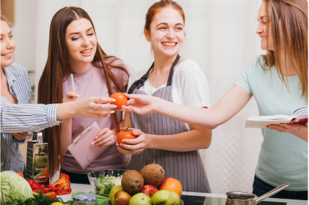 women cooking class vegetarian meal, a Food & Drink Photo by Photo Drive Studio
