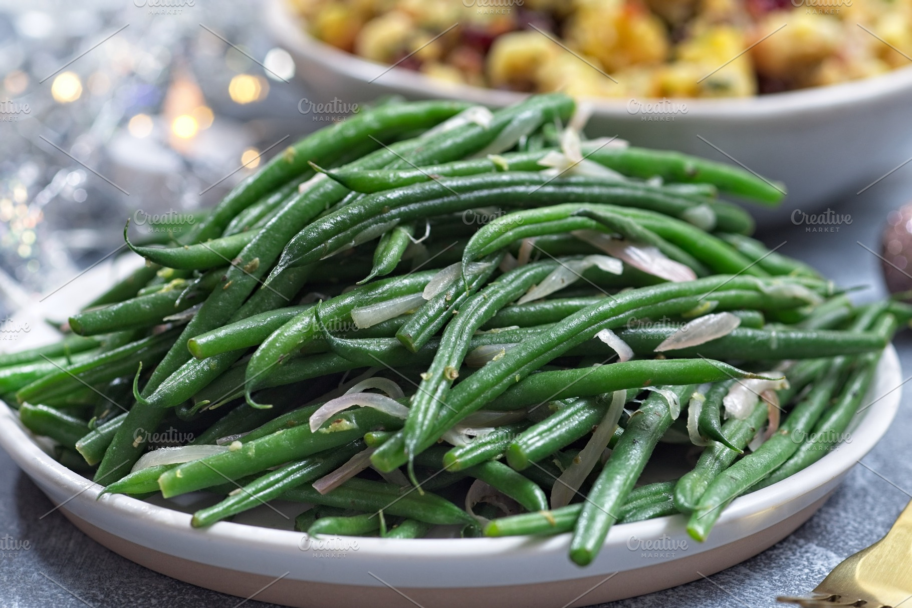 Haricot verts or French green beans with caramelized shallots, side dish, horiz, a Food & Drink Photo by iuliia_n