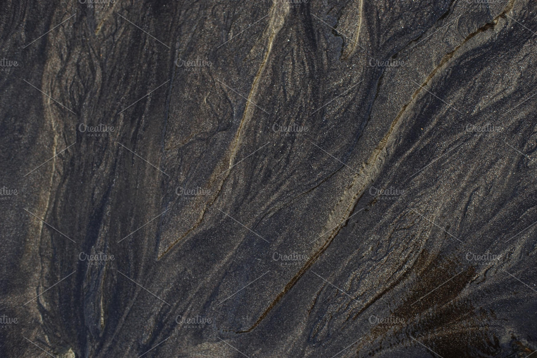 Close up of black rough sandpaper sheet texture use as background containing, an Abstract Photo by IlyaMarchenko