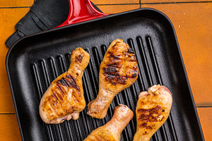 Succulent grilled drumsticks, marinated to perfection and served, a Food & Drink Photo by composter-box@mail.ru