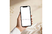 Minimalist Beige Phone in Hand Mocku, a Product Mockup by TatiMockup (Thumbnail 1 of 3)