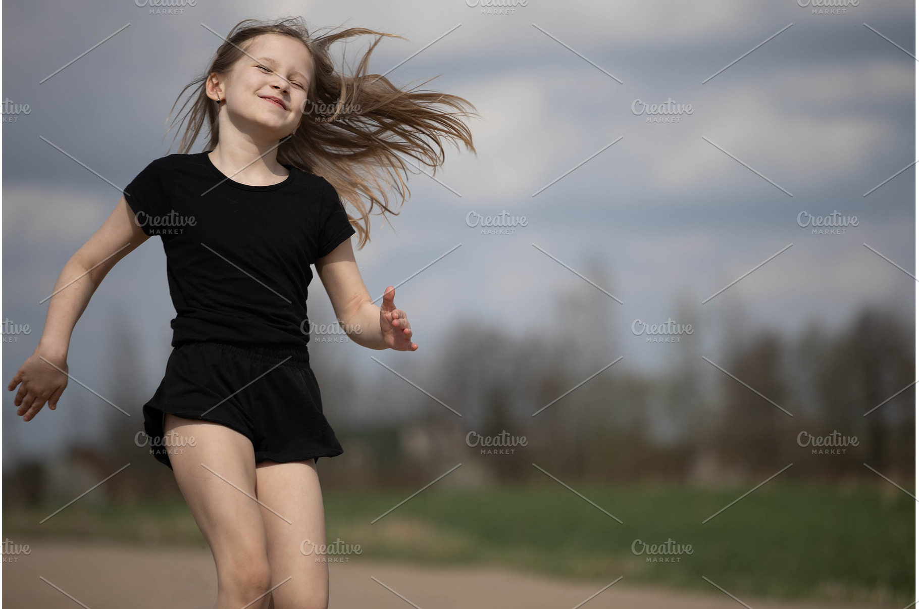 Little blonde girl runs fast along, a Sports & Recreation Photo by Nenahliadava Design