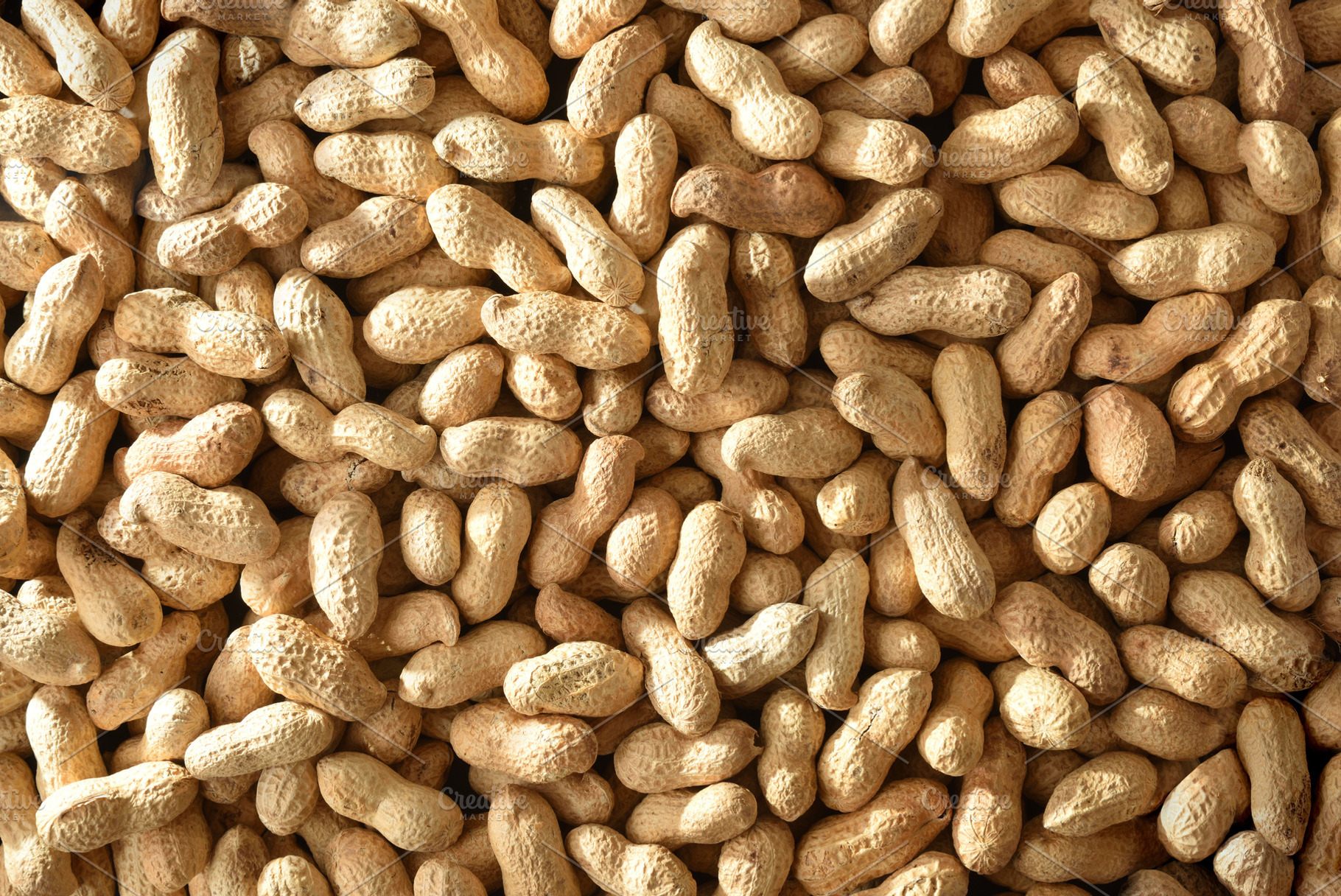 Background of a pile of peanuts in shell top view, a Food & Drink Photo by Davizro's Market