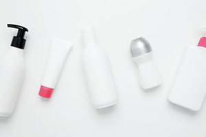 Cosmetic and skincare products including bottles and tubes arranged for brandin, a Photo by matucha