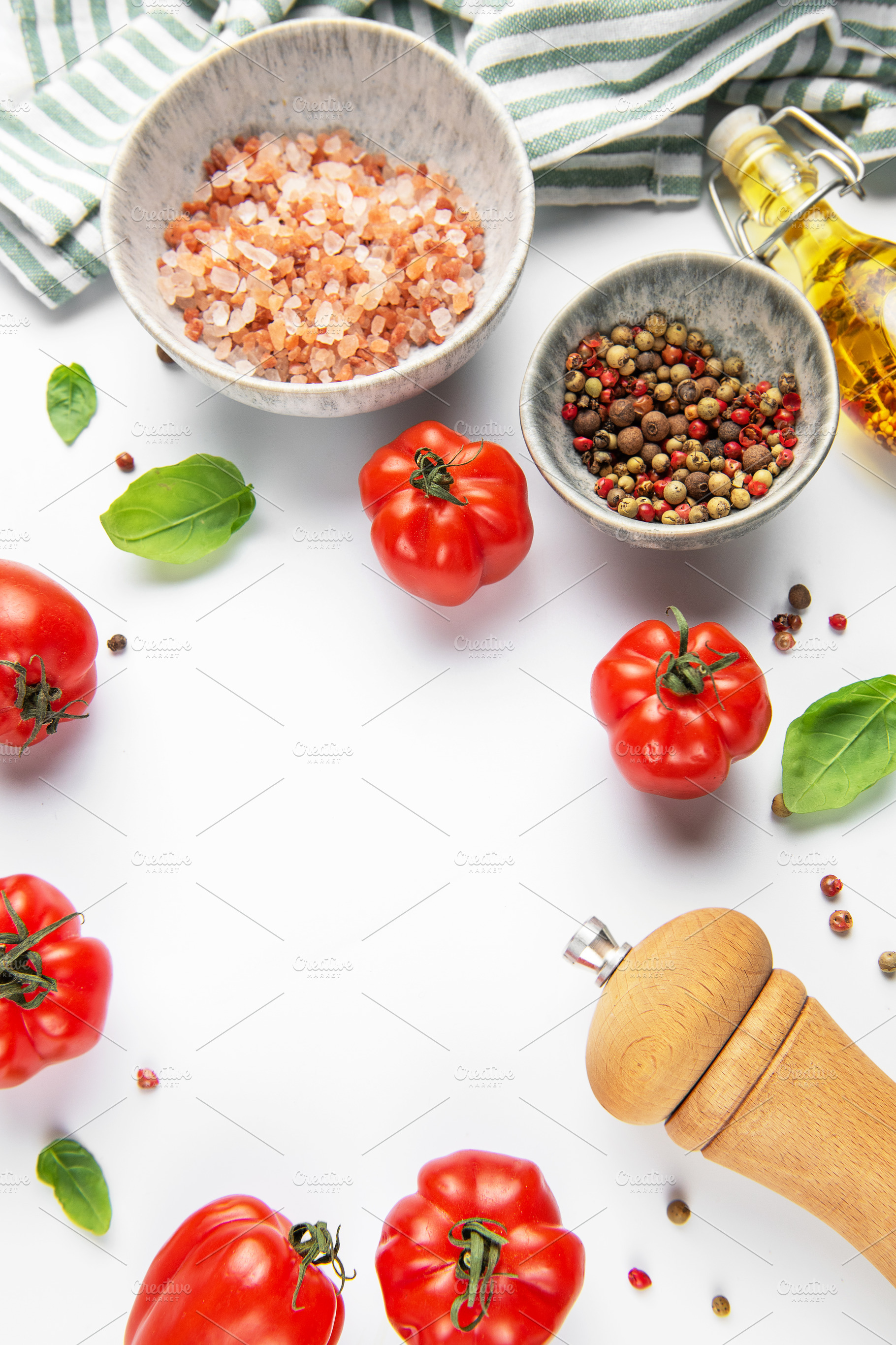 Fresh tomatoes, herbs, and spices on white background, a Food & Drink Photo by Olena Rudo