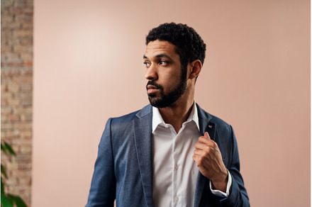 Serious young businessman looking, a Person Photo by HalfPoint