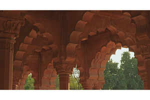 Intricate carved capitals and red