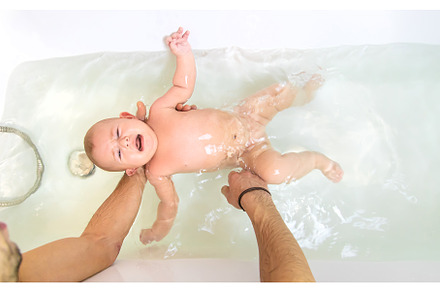 Little baby crying is afraid to swim, a Person Photo by yanadjana