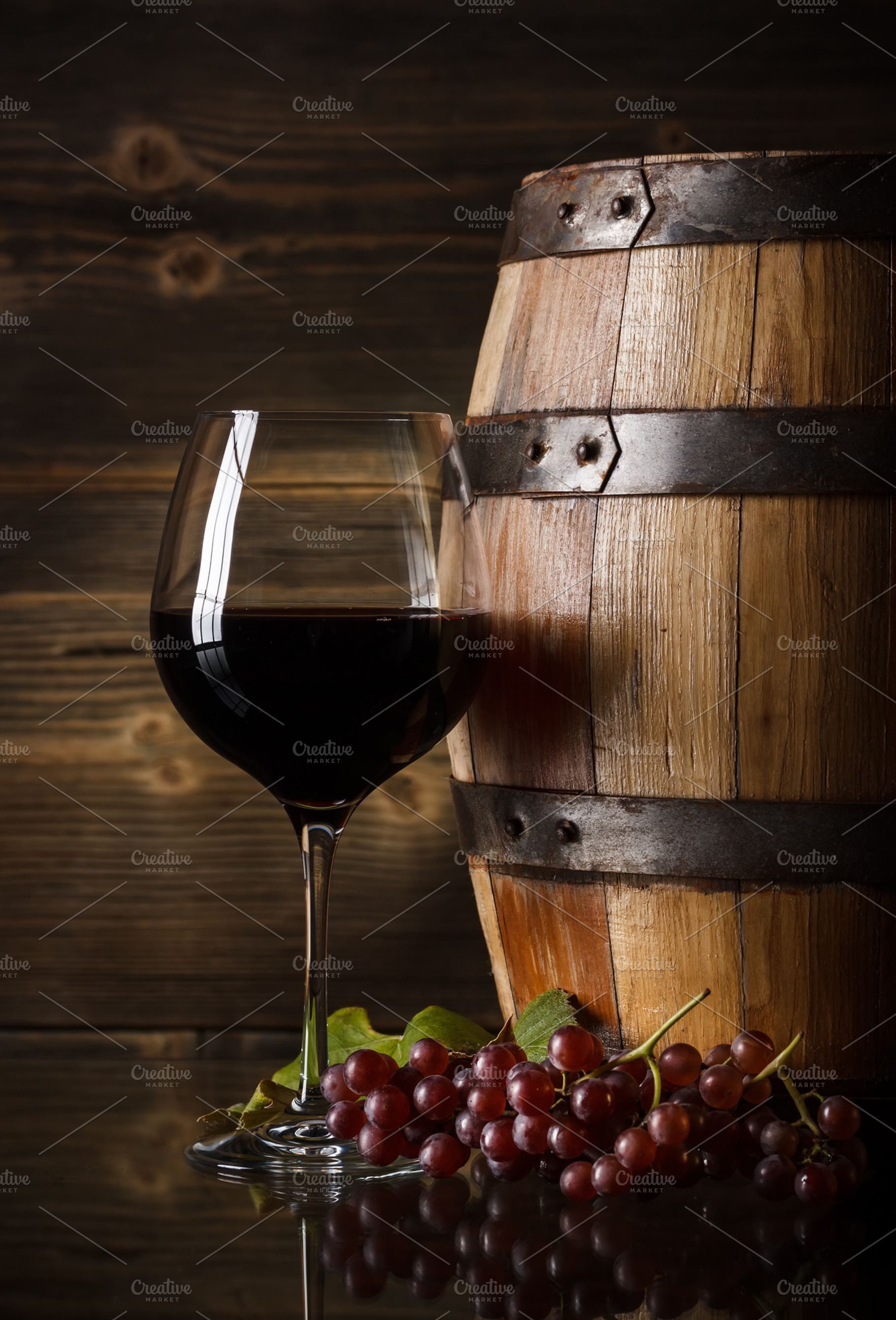 Glass of red wine stock photo containing alcohol and barrel