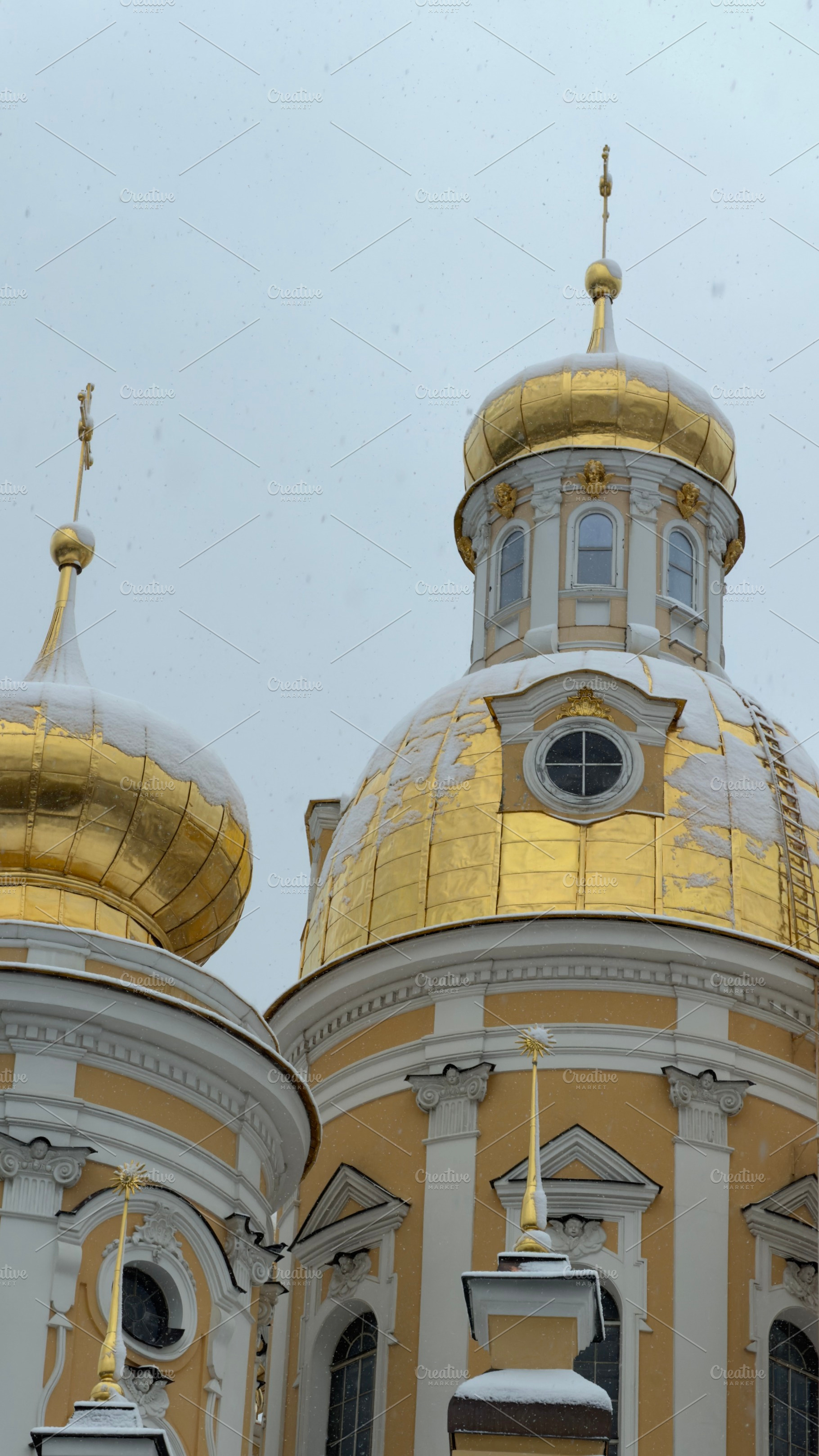 Golden domes of an ornate church against a gray sky, an Industrial Photo by Textures & Backgrounds