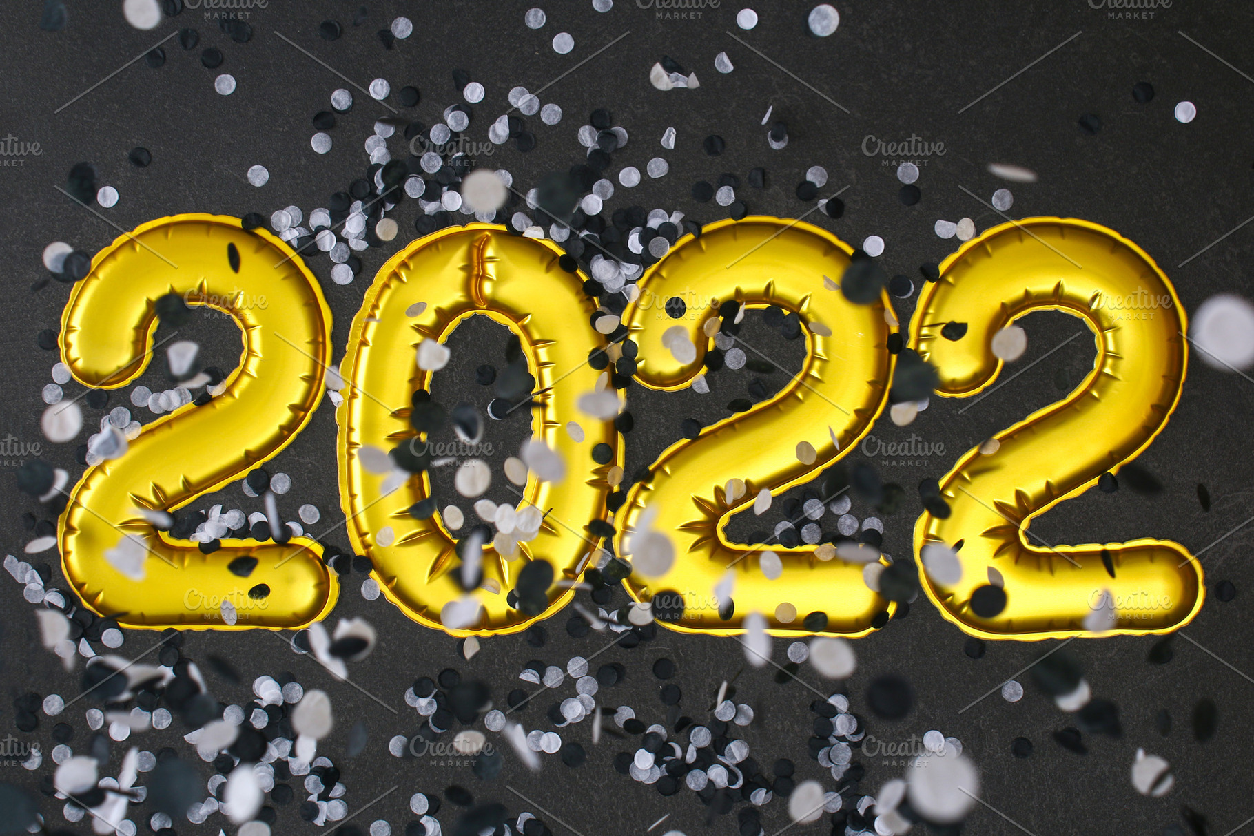 New Year 2022. Foil balloons numbers 2022 black background. New Year Christmas., a Holiday Photo by Detriana