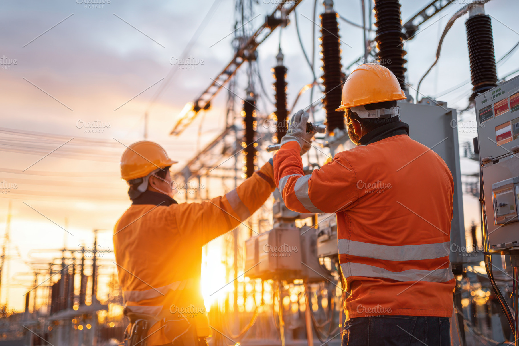 Workers maintaining power lines at sunset, an Industrial Photo by AlyaAnd