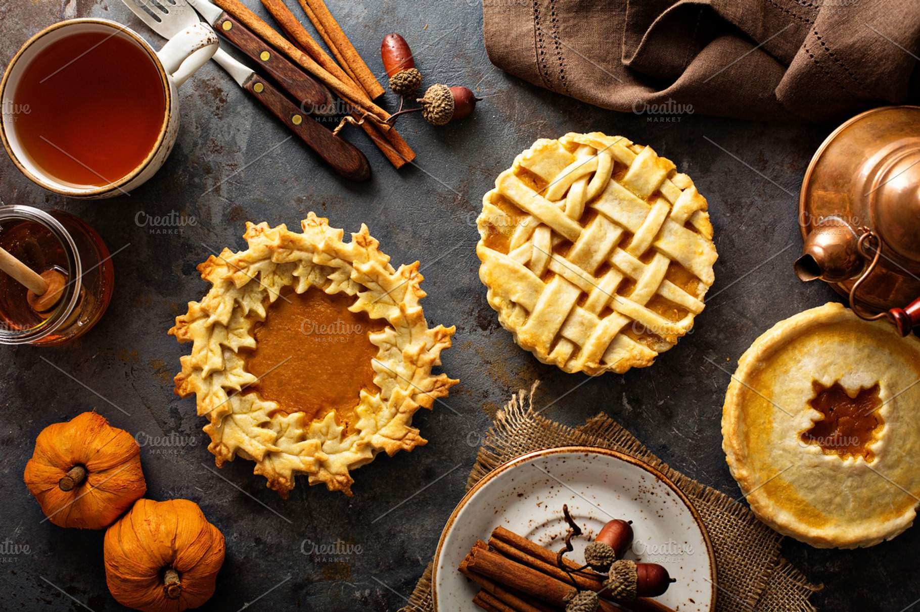 Homemade pumpkin pies decorated with fall leaves containing homemade, a Food & Drink Photo by farwasser