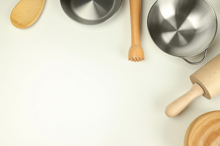 Different kitchen utensil on white background, top view, a Food & Drink Photo by AtlasStudio PRO