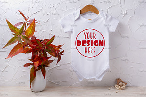 Baby bodysuit mockup with red grass