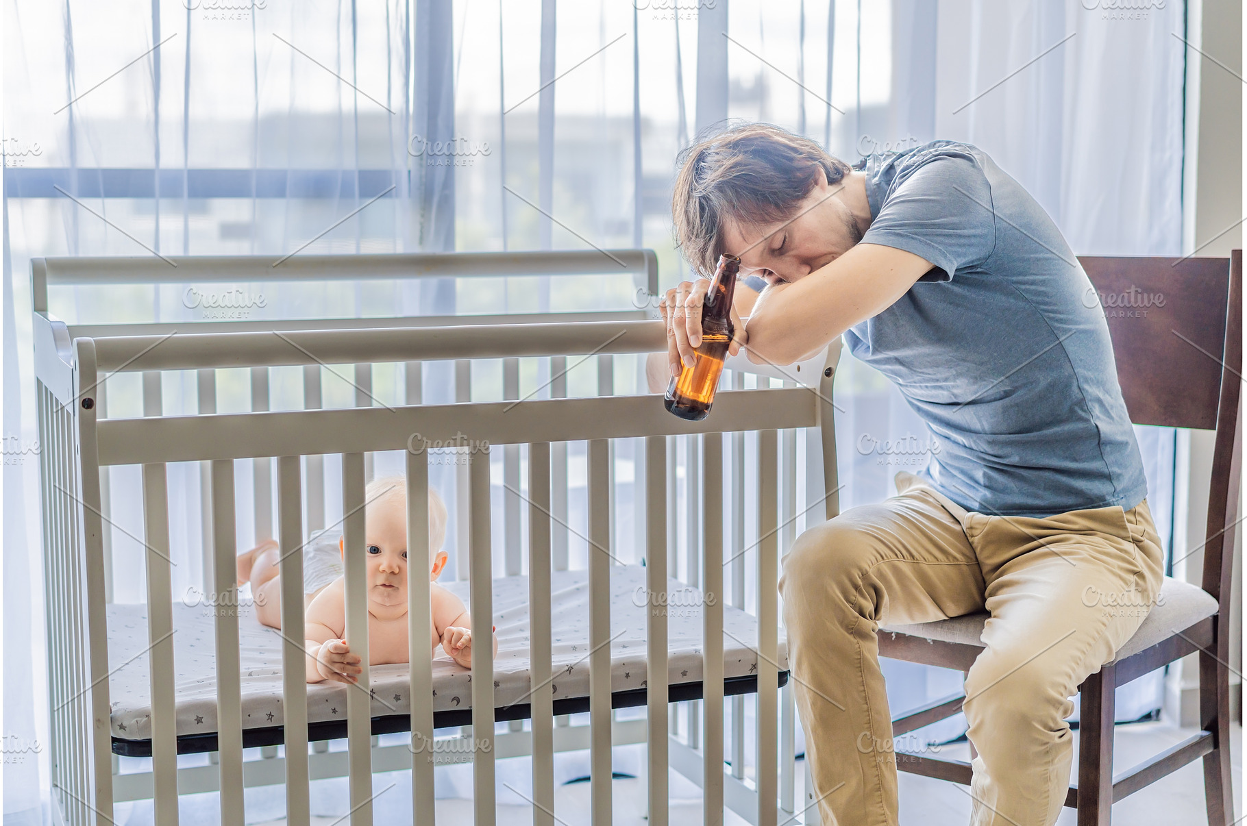 Sad father sitting beside his baby, a Person Photo by Elizaveta Galitskaya