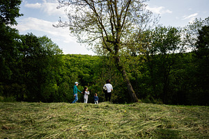 A group enjoying nature together in a scenic forest clearing, a Person Photo by AS photostudio