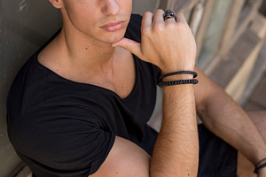 Serious young man posing in sunlight outdoors, a Person Photo by RF Images