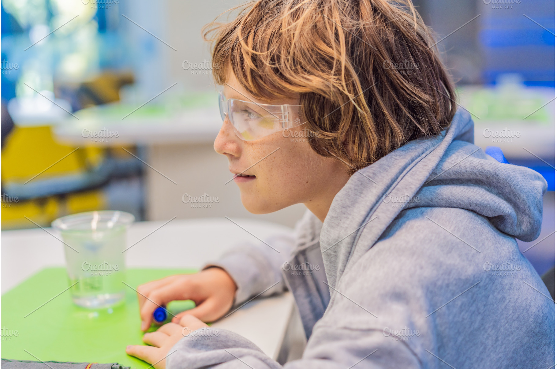 Teenage boy wearing safety glasses, a Technology Photo by Elizaveta Galitskaya