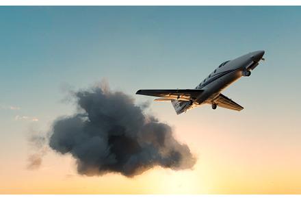 Airplane taking off through a cloud