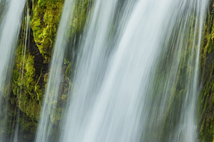 Powerful cascade falls on mossy break