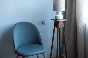 Minimalist armchair in modern living room interior with floor la, an Industrial Photo by MDBildes