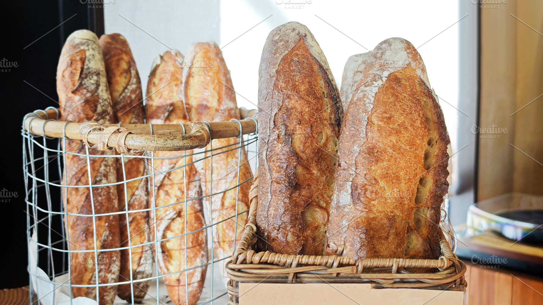 Freshly baked French bread showing texture and golden crust, a Photo by salmon.black
