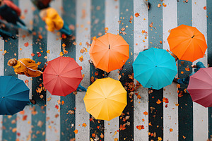 Colorful umbrellas brighten a rainy street with autumn leaves in a vibrant urba, a Photo by AlyaAnd