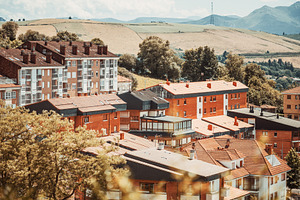 Tineo rooftop, distant mountain, an Architecture Photo by SkyNext
