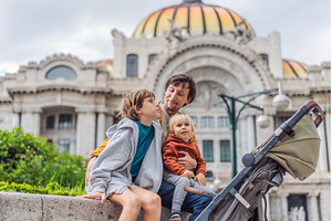 Father tourist with his two sons in, an Architecture Photo by Elizaveta Galitskaya