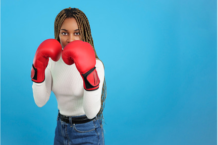 African woman with boxing gloves and, a Person Photo by Iván Moreno STOCK PHOTO